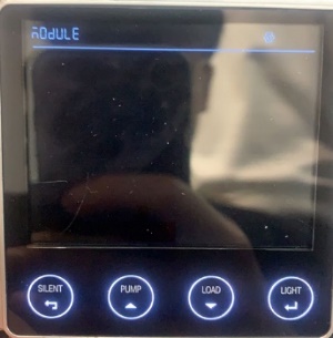 PMLCD or PMLCD-BT screen showing Module in the top-left corner with LOAD and LIGHT buttons below.